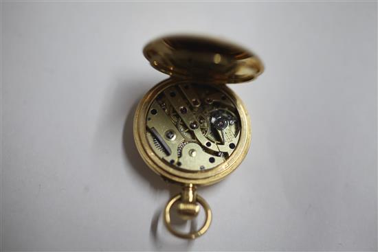 An early 20th century 18ct gold half hunter fob watch with a 15ct gold bracelet,